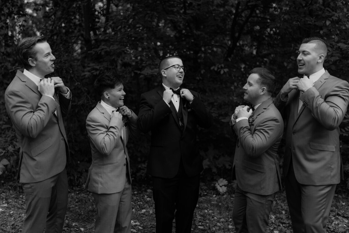 black and white image groomsmen posing