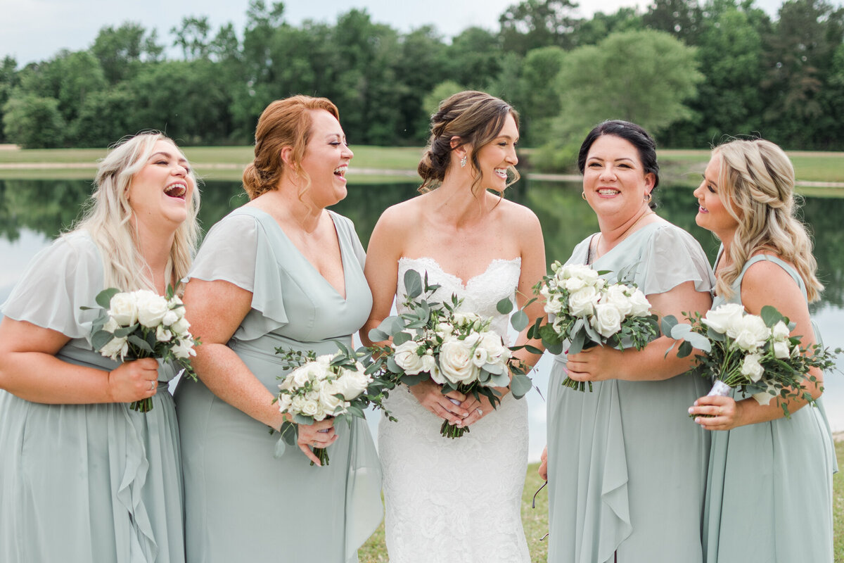 bridal party laughing during their photos in wilmington, nc