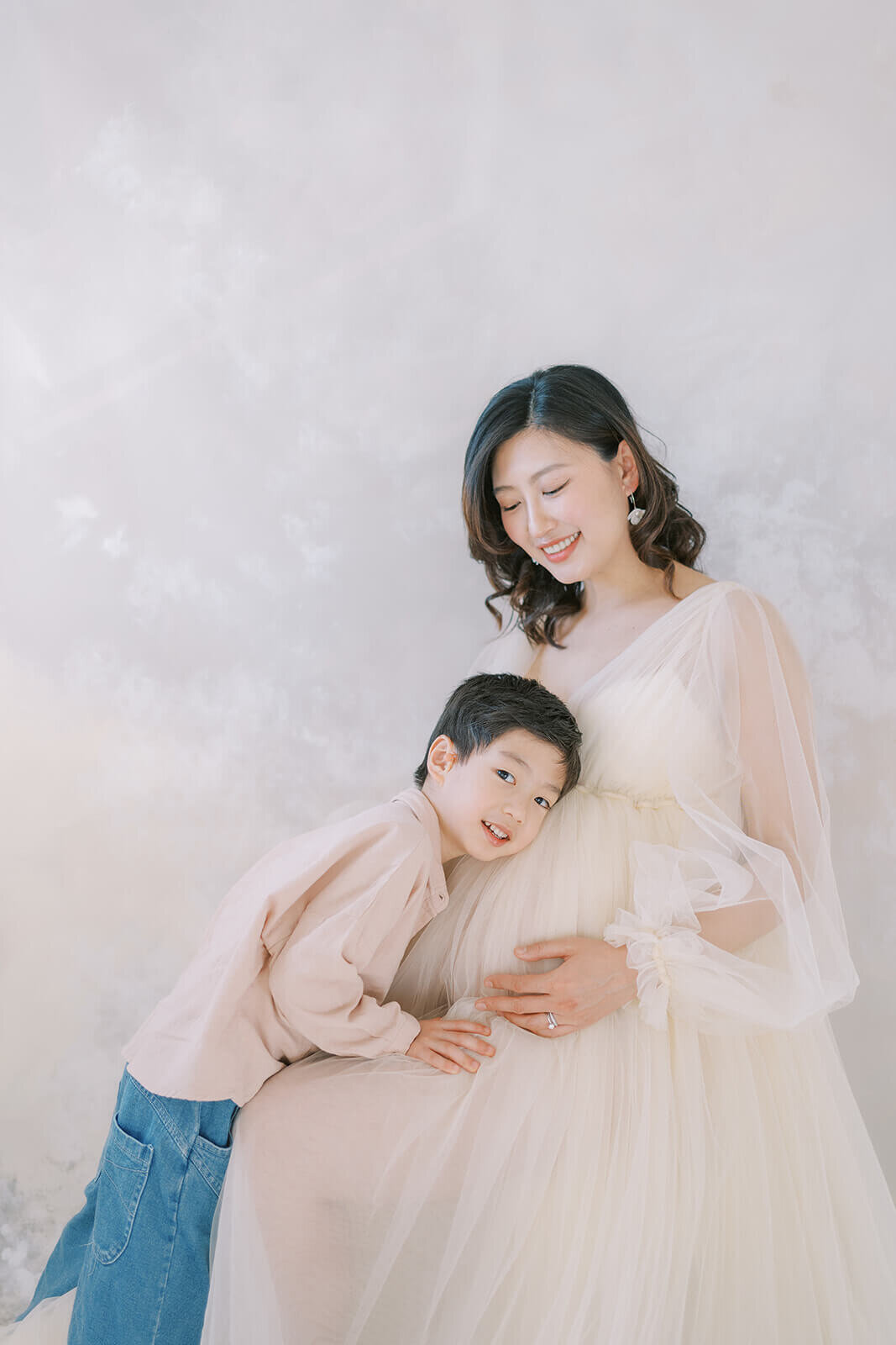 Celebrate pregnancy's beauty as an Asian mum of Chinese descent graces a Gold Coast natural light studio with her son