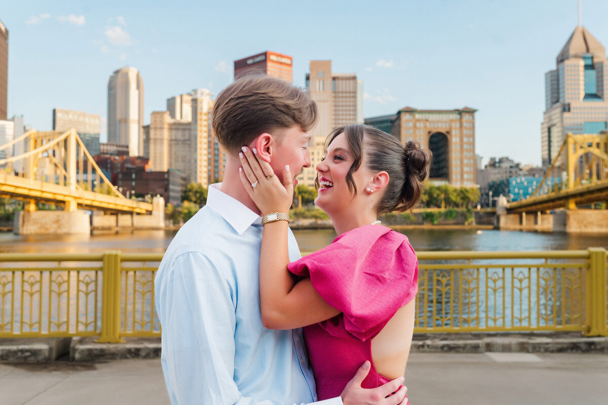 couple smiling and kissing after north shore proposal
