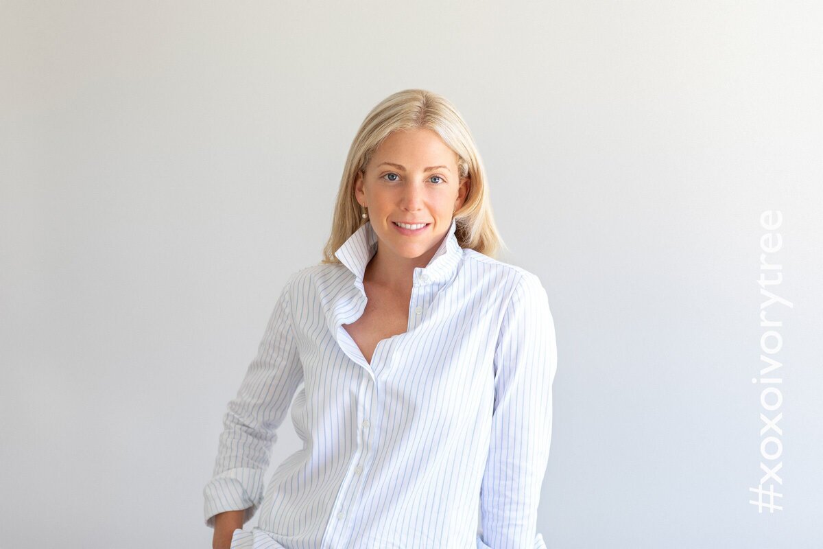 Philadelphia headshot of a woman wearing a simple white blouse