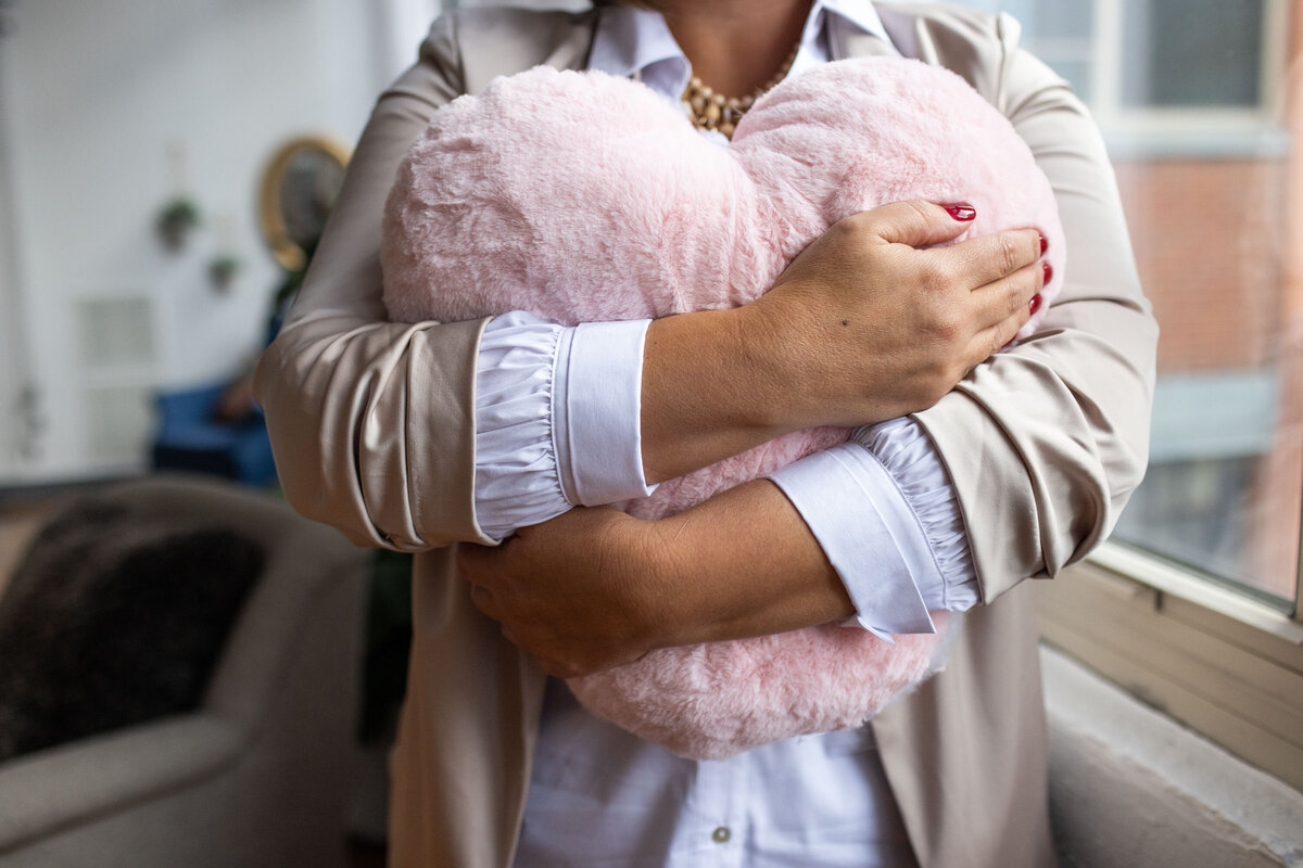 Brand Photography Studio Sessions_Coach-huging heart pillow