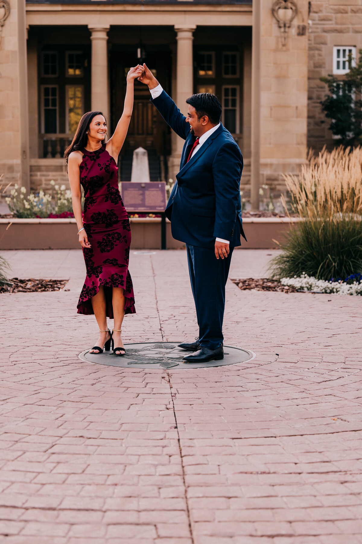 couple dancing in the courtyard of a historical building