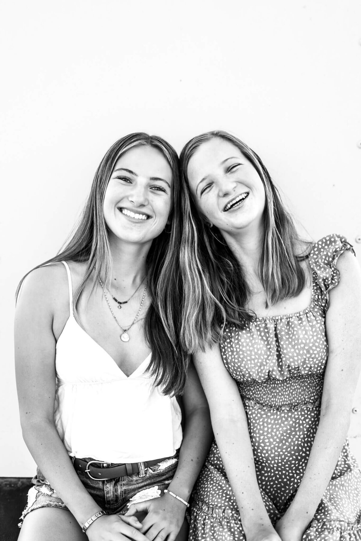 Sisters posing for camera