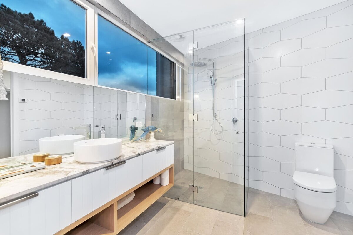 Bathroom with glass shower screen and white toilet