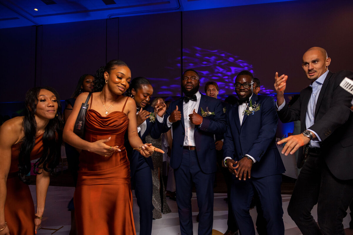 Tomi and Tolu Oruka Events Ziggy on the Lens photographer Wedding event planners Toronto planner African Nigerian Eyitayo Dada Dara Ayoola ottawa convention and event centre pocket flowers Navy blue groom suit ball gown black bride classy  261