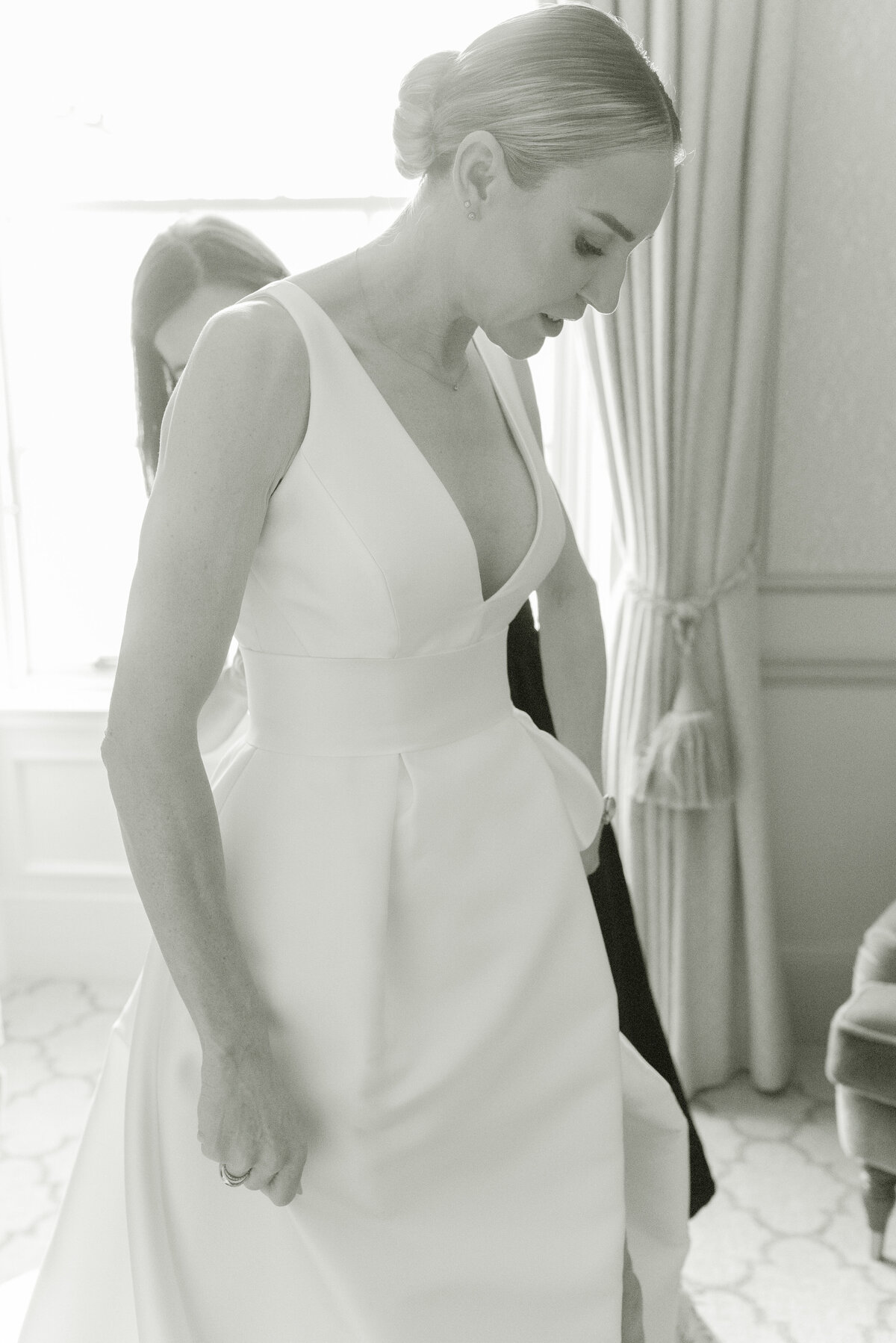 Black and white image of Bride getting ready on the morning of her Gleneagles wedding day.  Image by luxury fine art wedding photographer, Jill Cherry Porter.