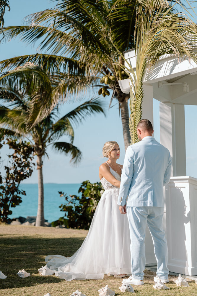 a couple says their wedding vows in the Bahamas