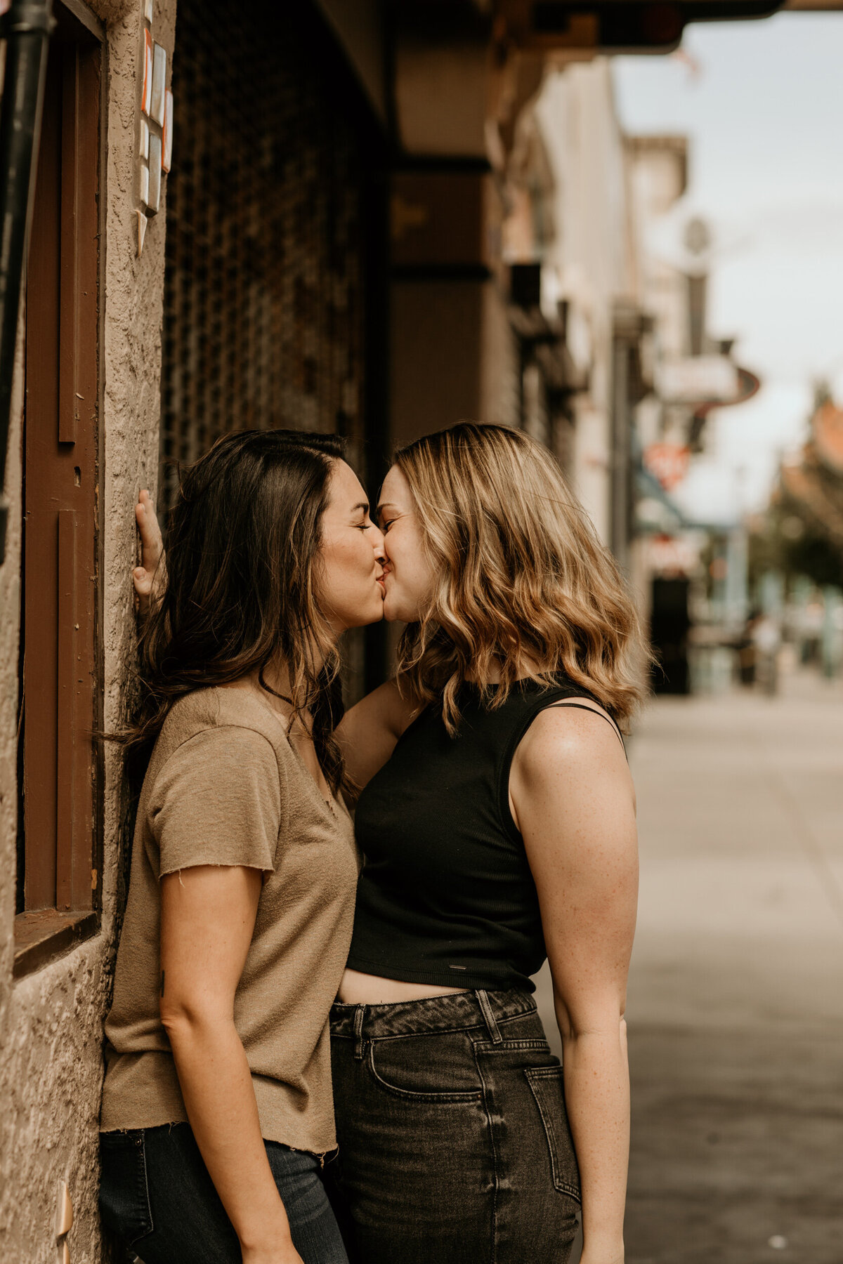 same sex couple kissing in downtown Albuquerque
