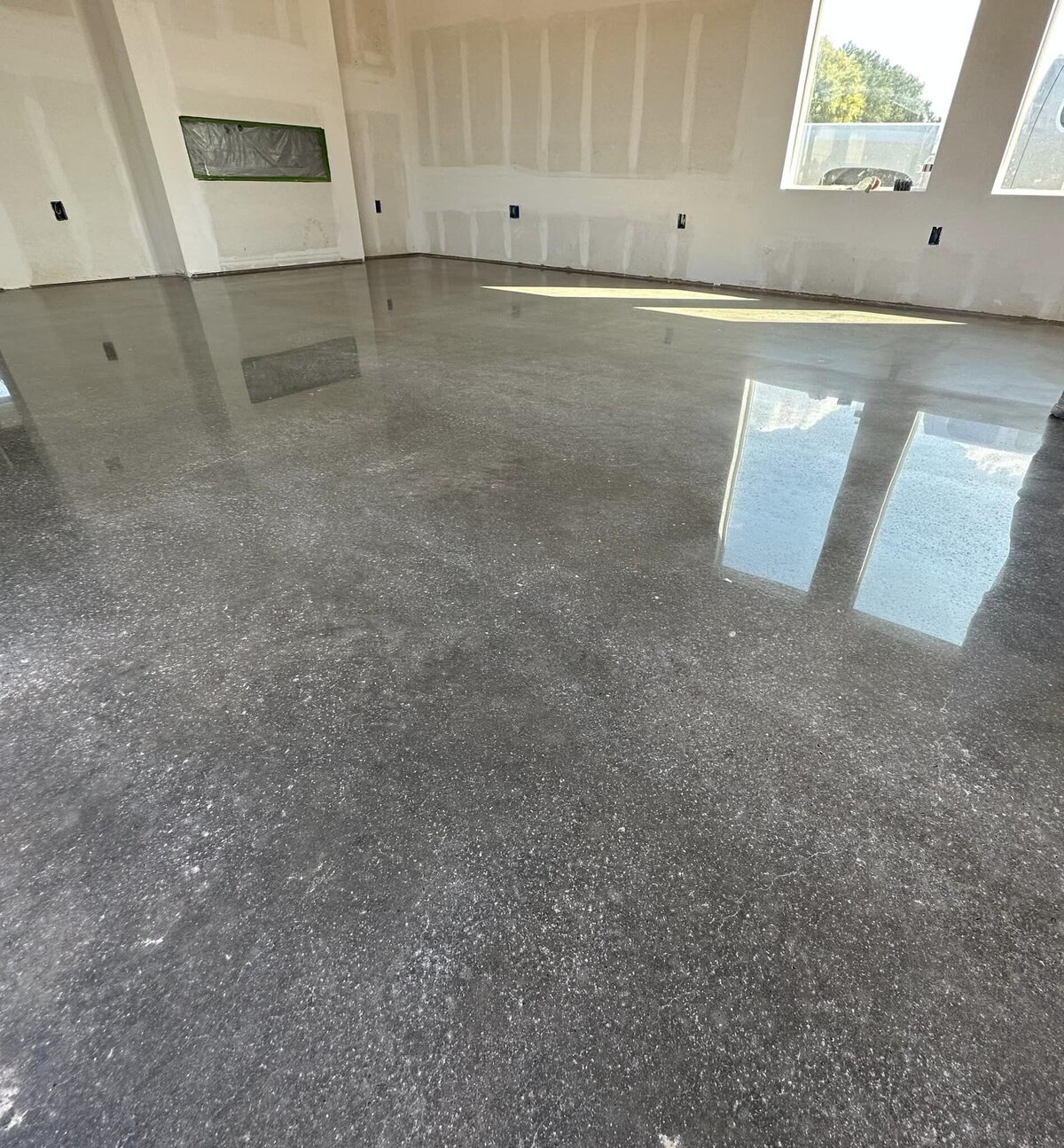 Custom Polished Concrete Floors for Homes in DFW showcasing a beautifully finished concrete floor in a residential space, highlighting the smooth, modern, and durable surface perfect for home interiors in the Dallas-Fort Worth area.