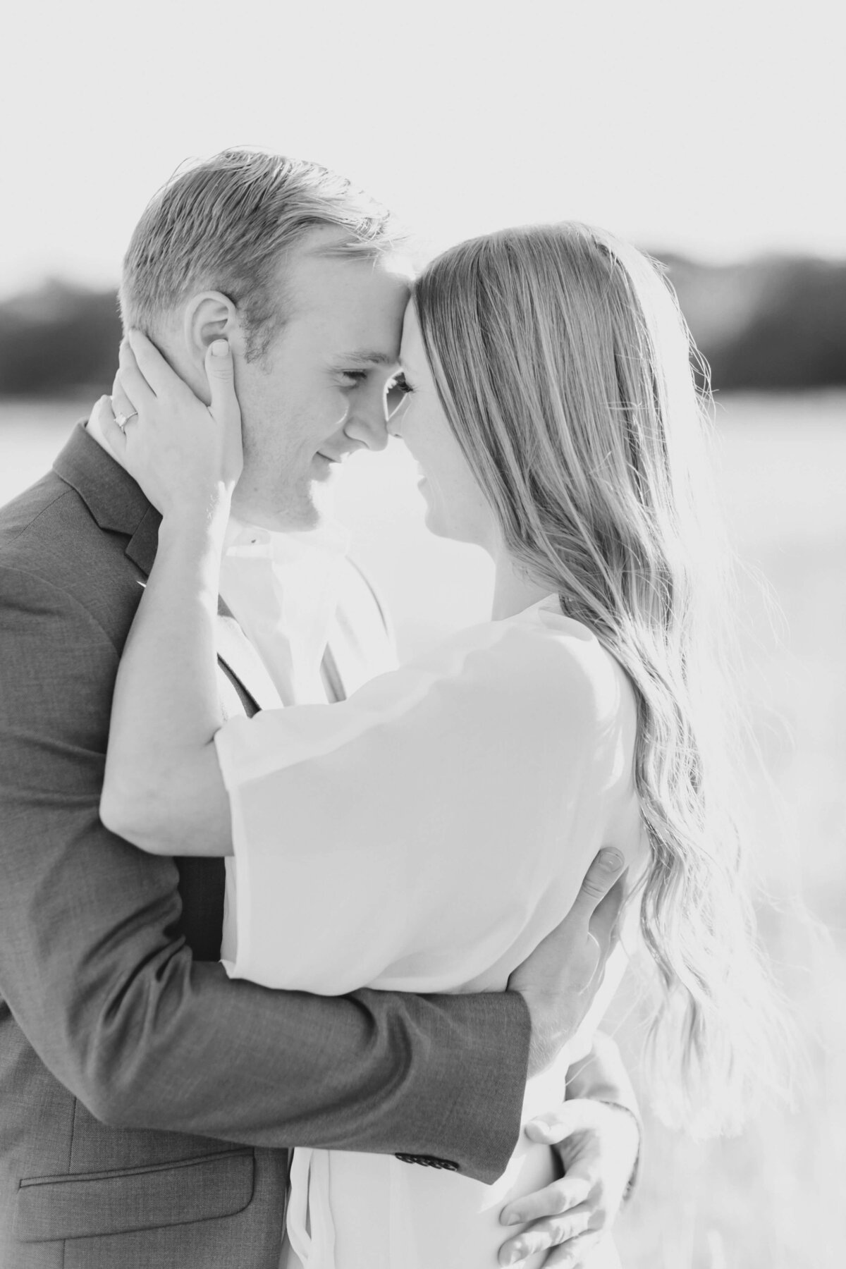 Black and white closeup of a couple embracing