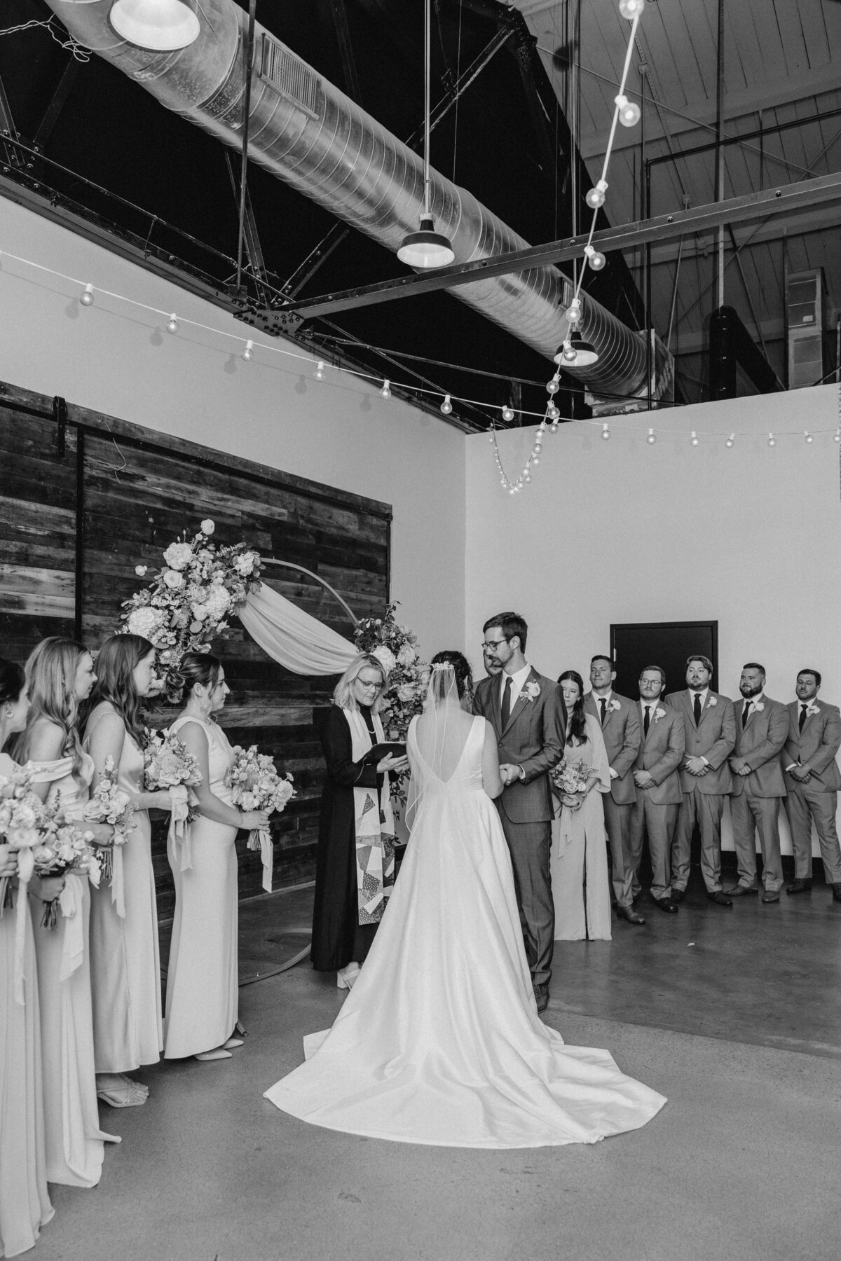 Wide shot of wedding ceremony in progress at Market Hall, Raleigh NC