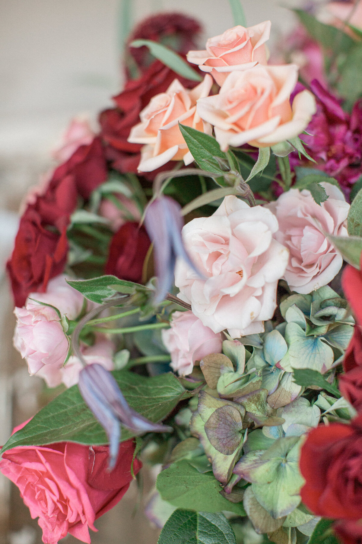 A bouquet of roses, hydrangeas, and star flowers.