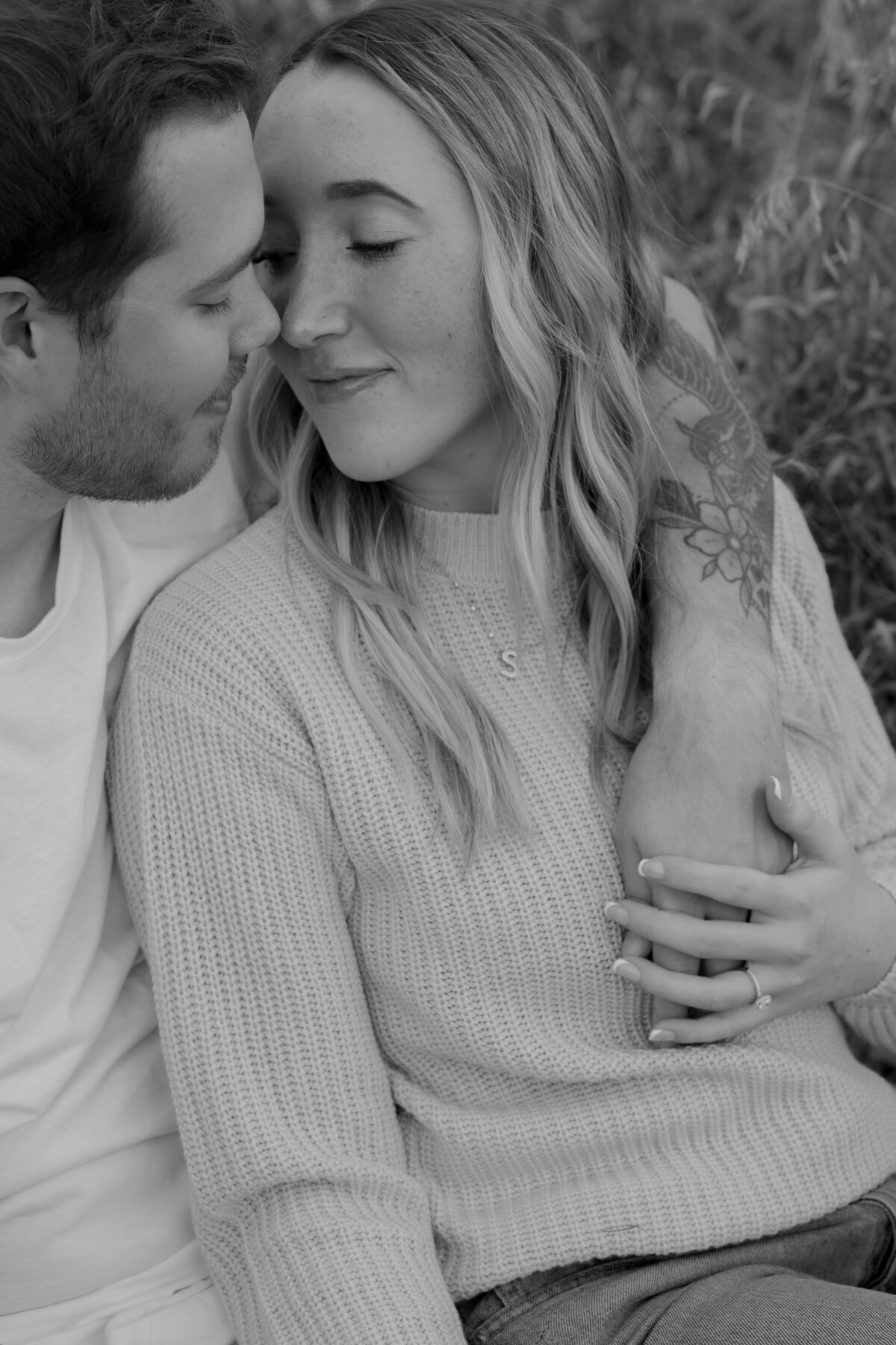 Couple's engagement session in Omaha during golden hour, surrounded by warm fall foliage – captured by Tori Nichole Photography. Authentic, romantic moments in a stunning autumnal setting, reflecting the beauty of the season and their love story.