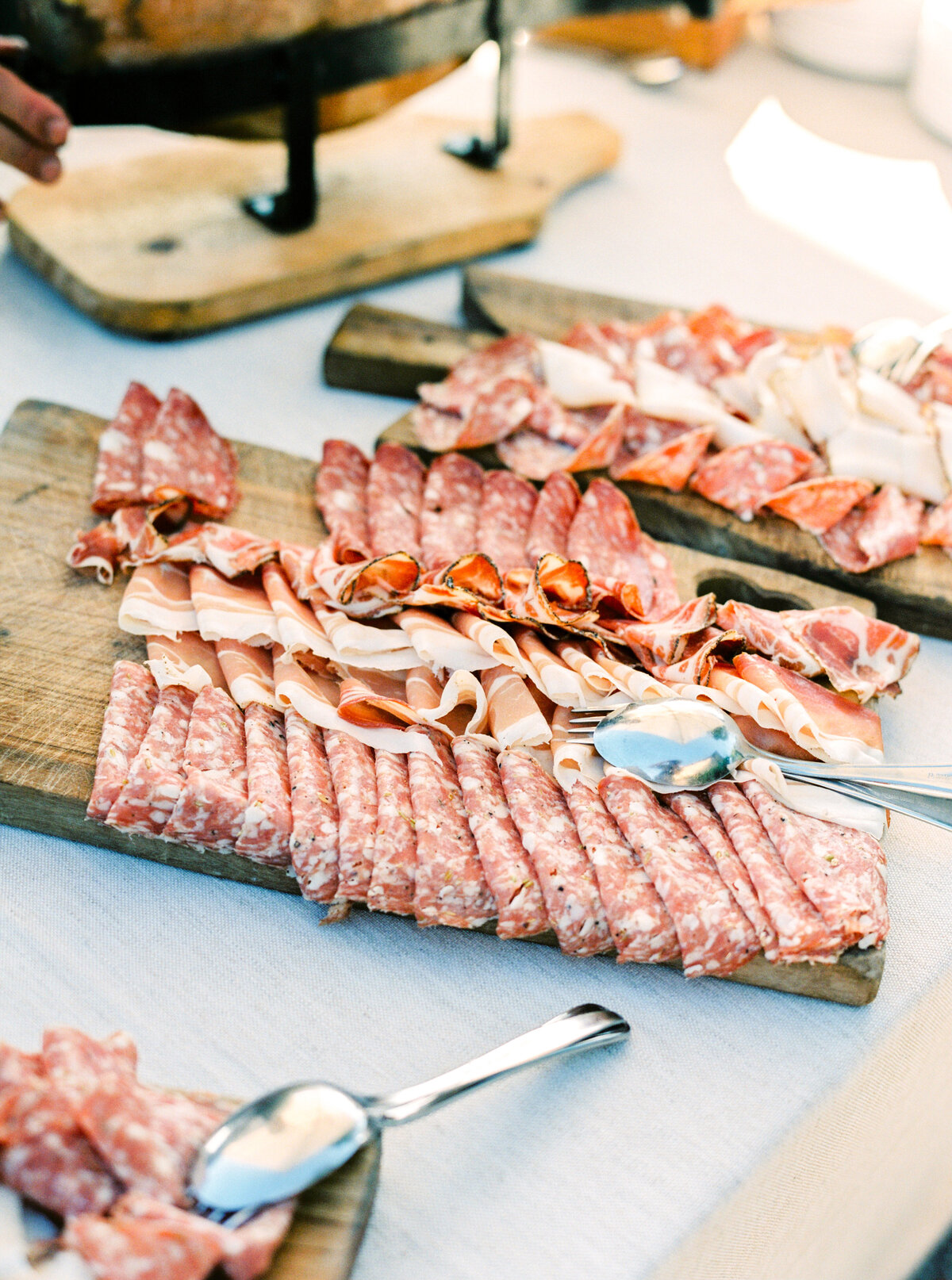 Film photograph of charcuterie meats photographed by Italy wedding photographer at Villa Montanare Tuscany wedding