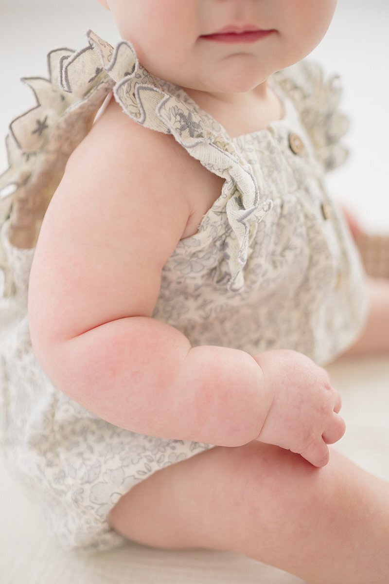 Close up of chunky baby arm with rolls