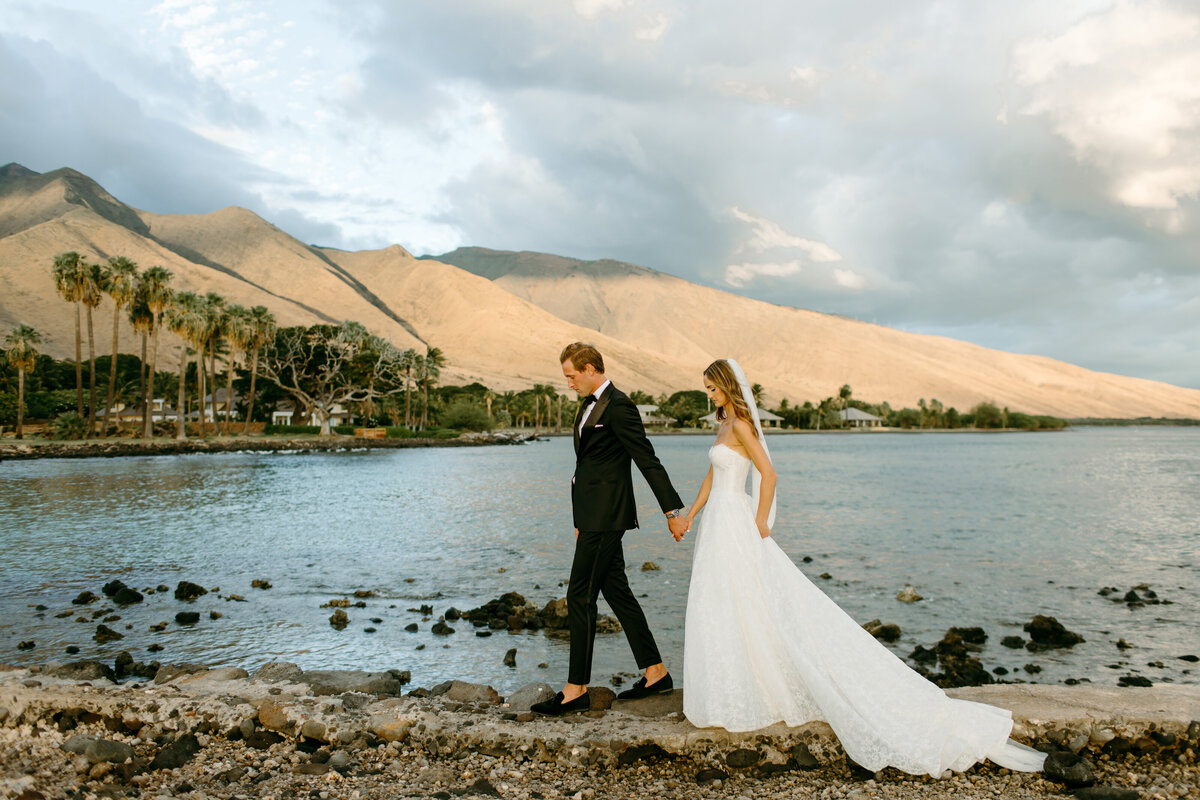 bride and groom on a boat in maui