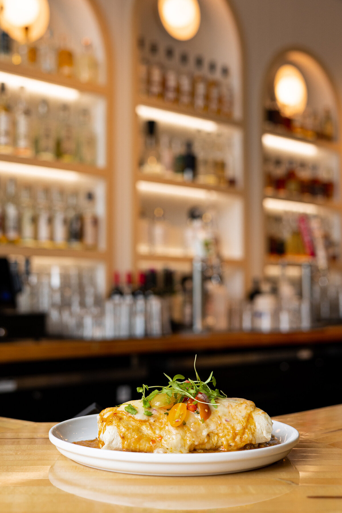 A breakfast burrito sits on a bartop at a restaurant in Fort Collins, Colorado.