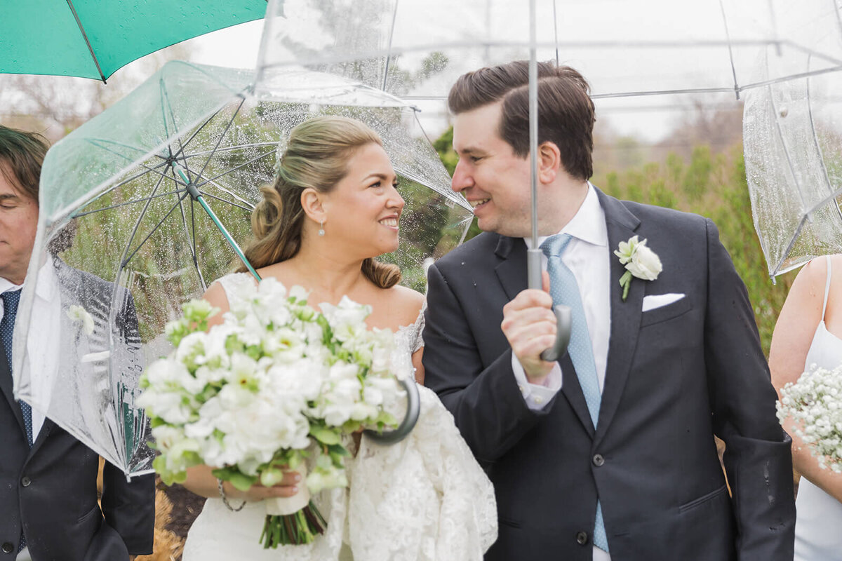 Bride and groom portraits under an umbrella