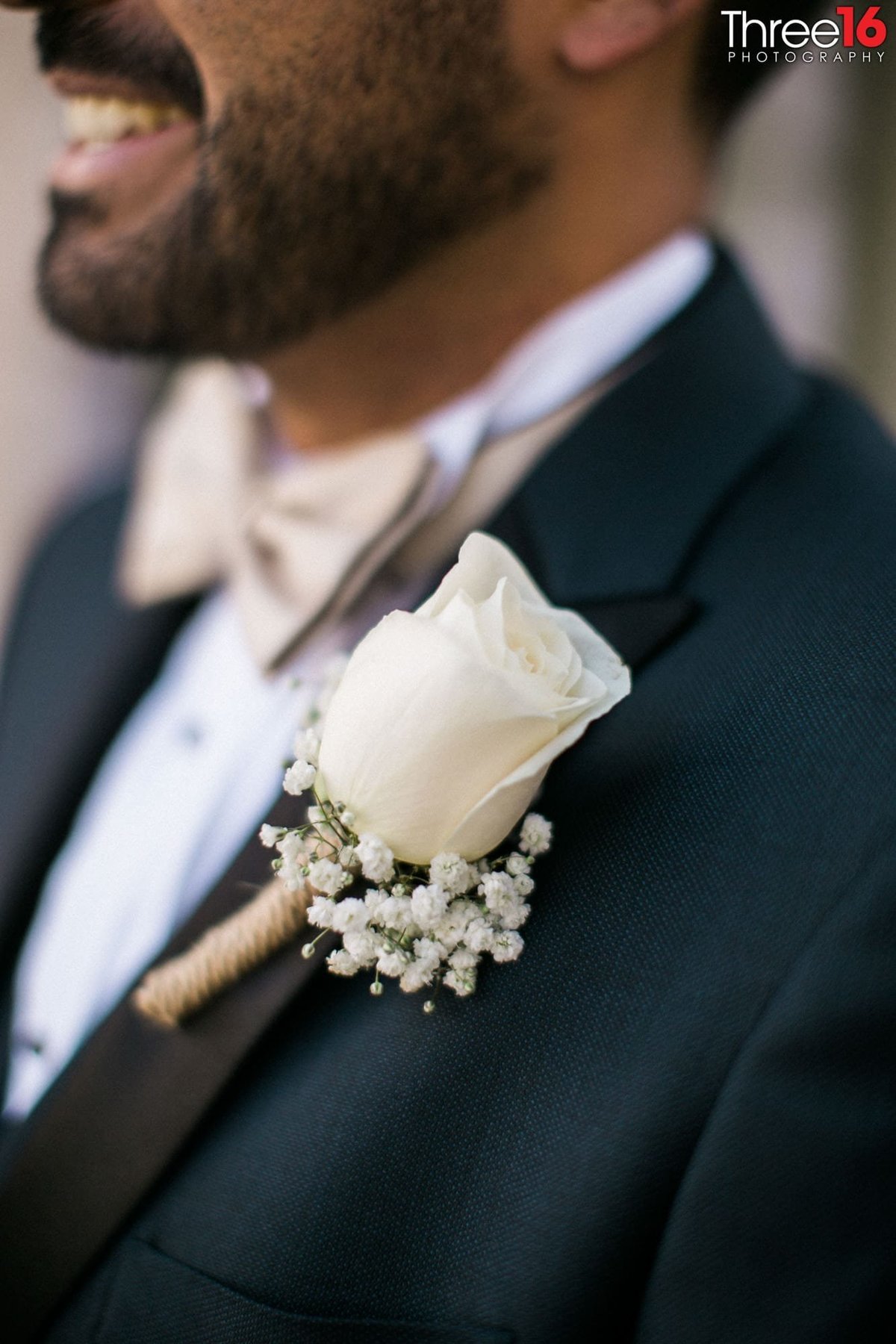 Groom's beautiful white rose boutonniere