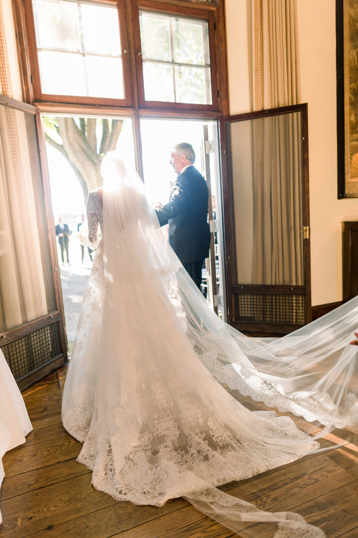 The bride getting ready to walk down the aisle with her father. 