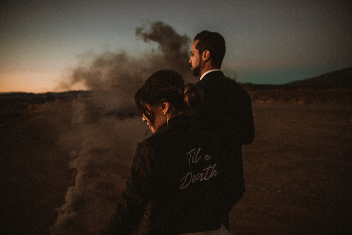 taos new mexico wedding with couple wearing 'til death jacket
