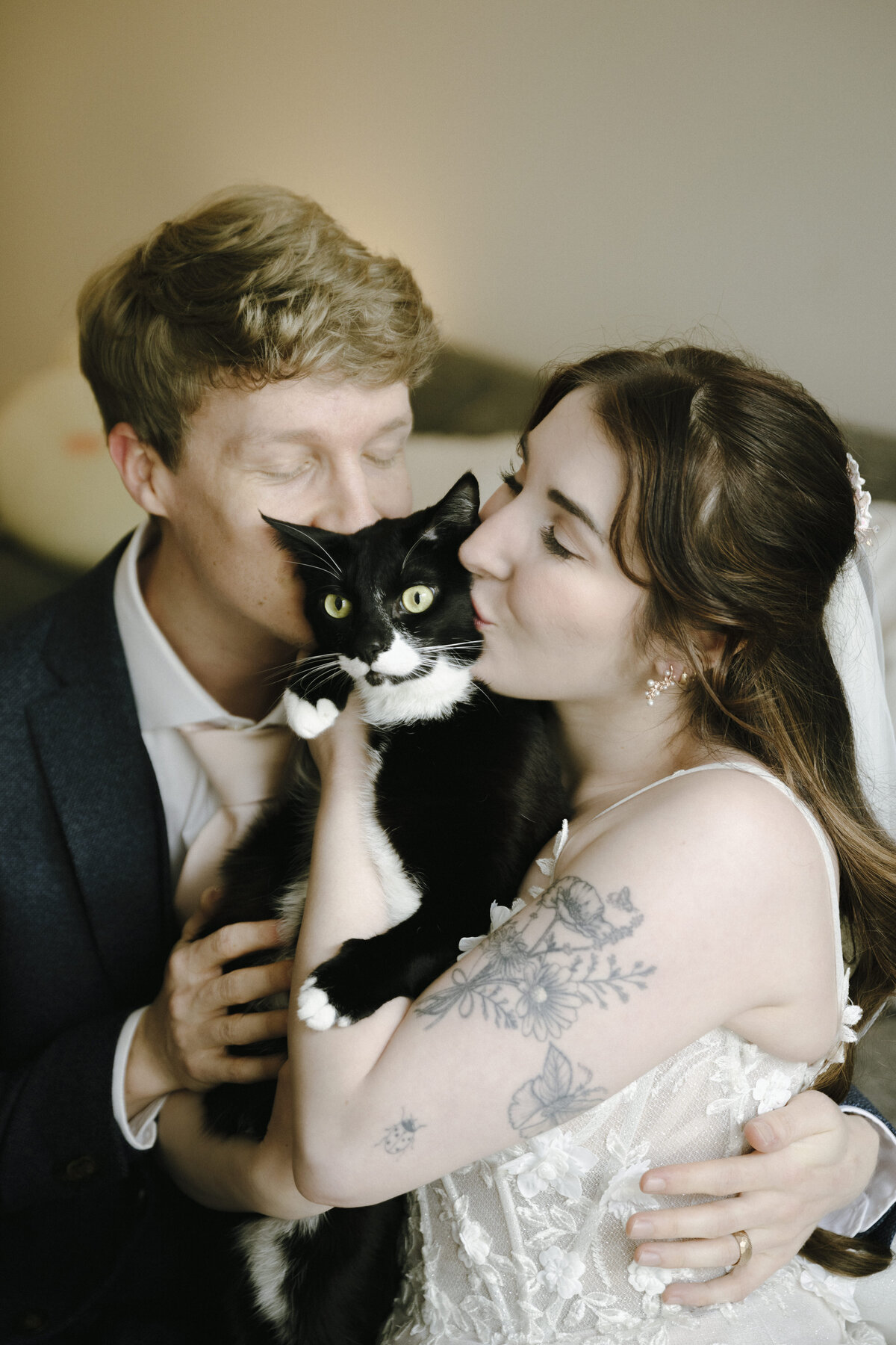 Bride and Groom with their tuxedo cat