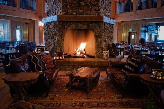 cozy warm fire place in an empty log cabin room