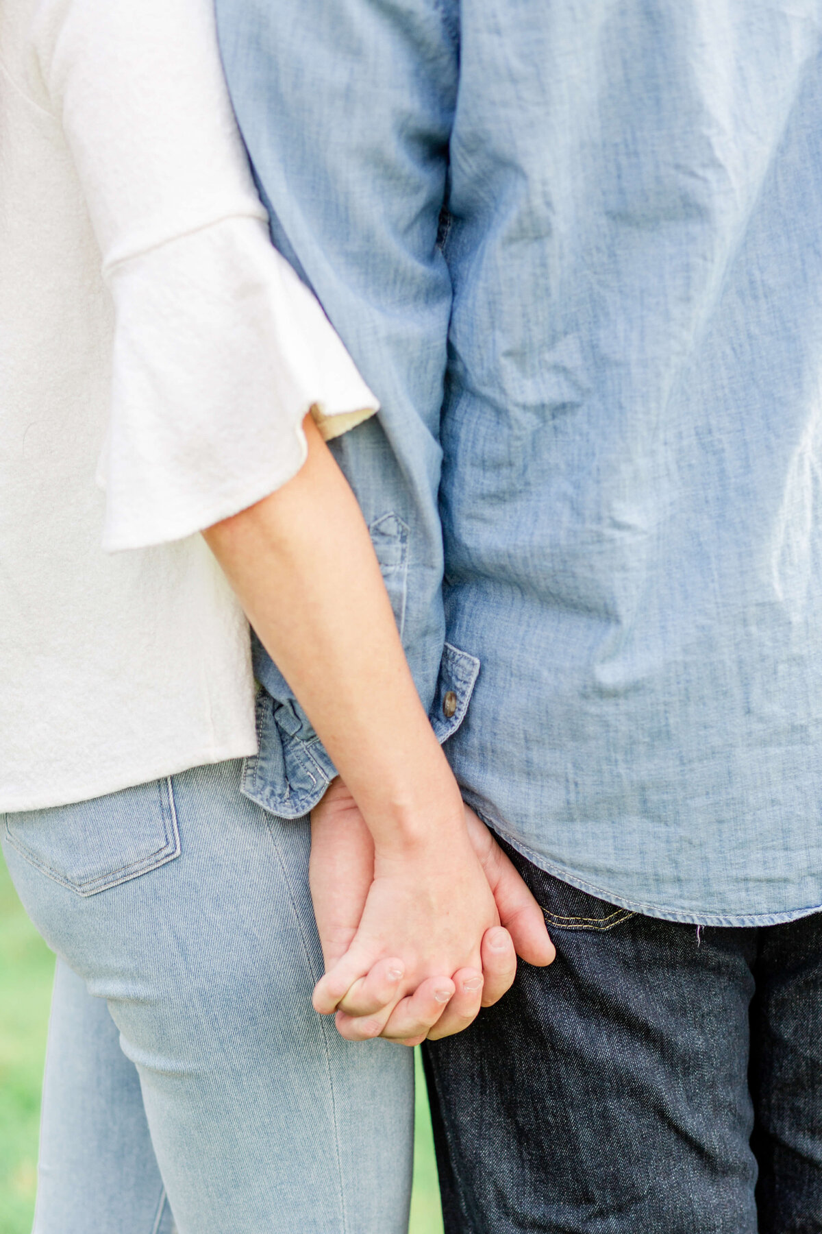 Happy-couple-in-love-holding-hands-posing-for-engagement-photos-in-Midwest-3
