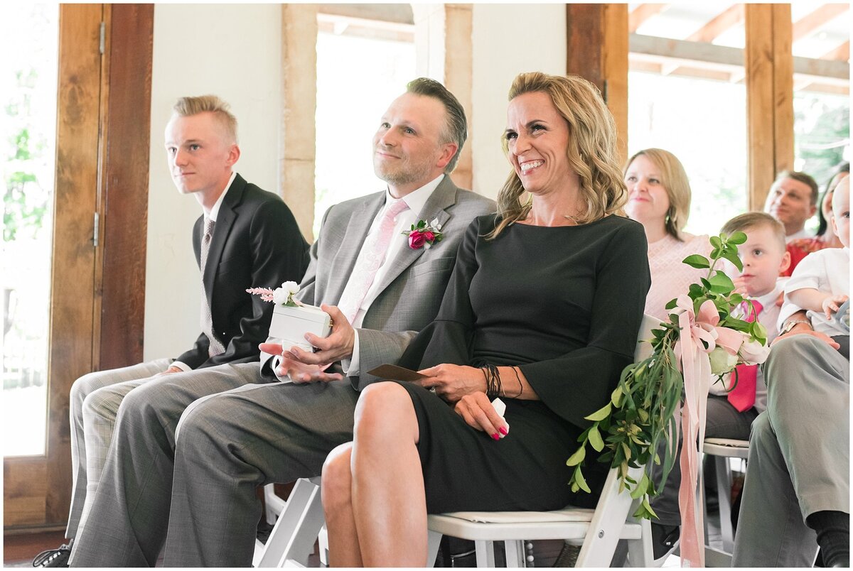Parents smiling during wedding ceremony at Wadley Farms