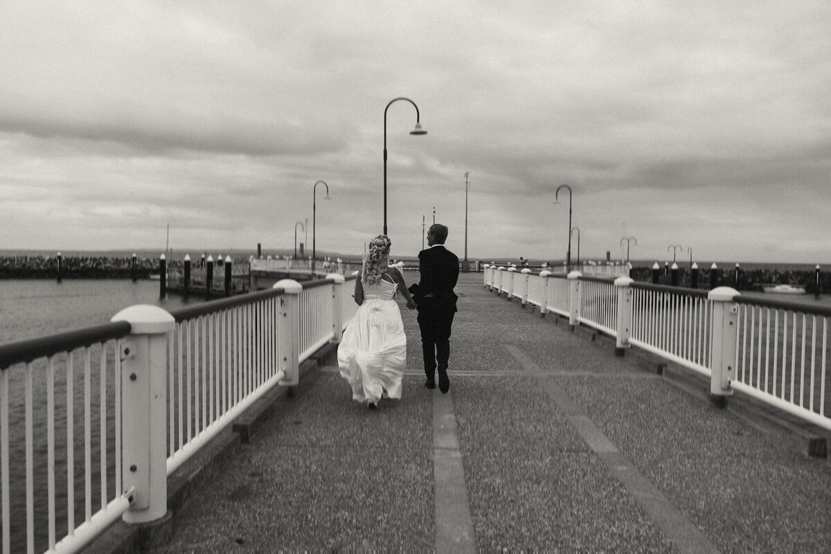 Bride and groom enjoying a candid moment during a Sunshine Coast wedding.