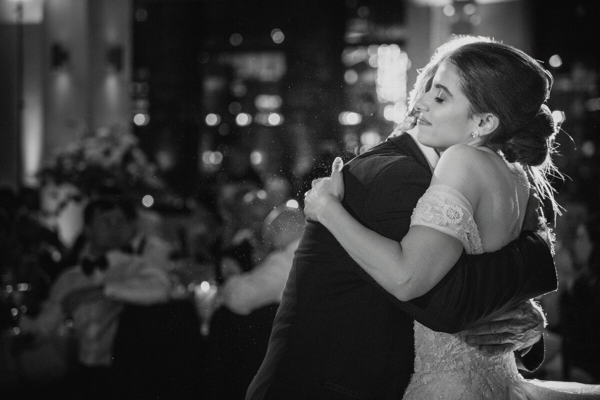 A bride hugs her father at a Tribeca Rooftop wedding in Manhattan
