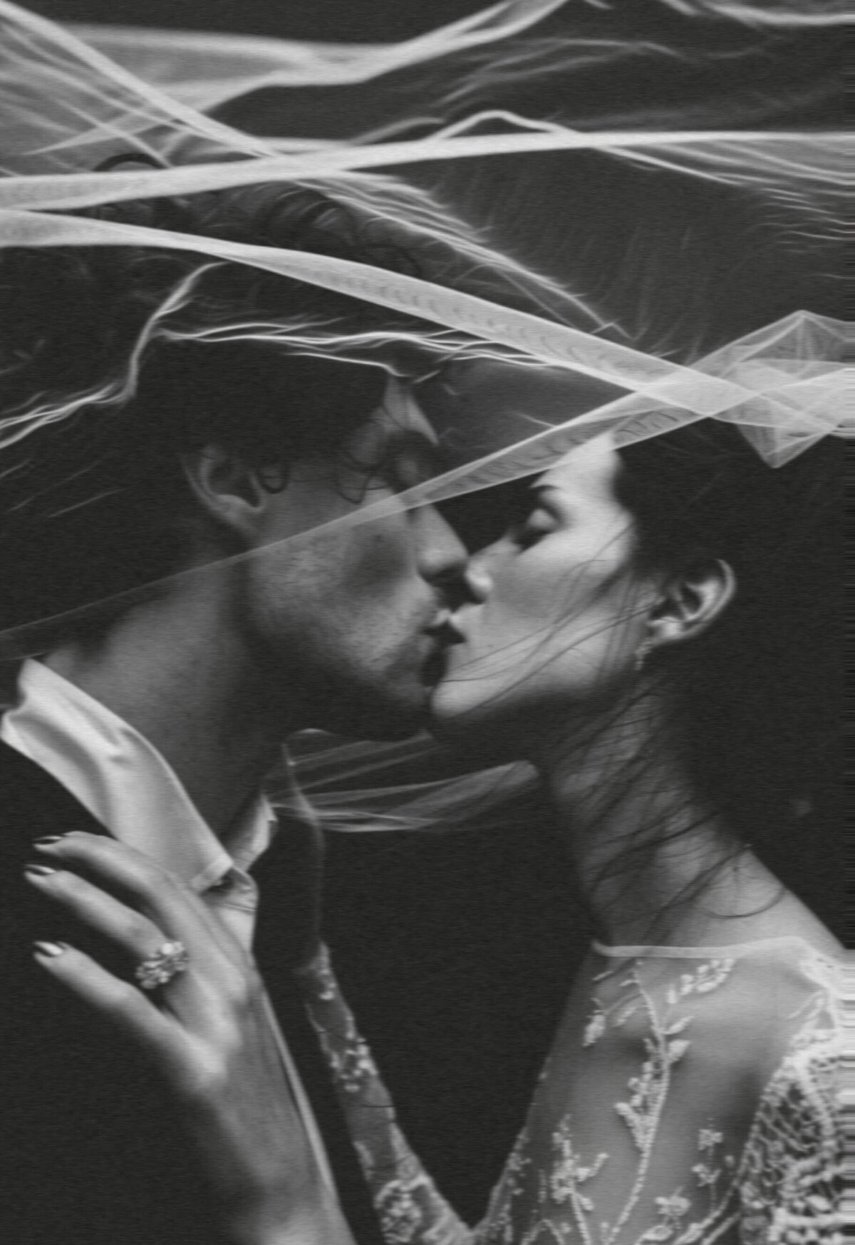 A bride and groom kissing representing the bridal show by The Crush Collective.