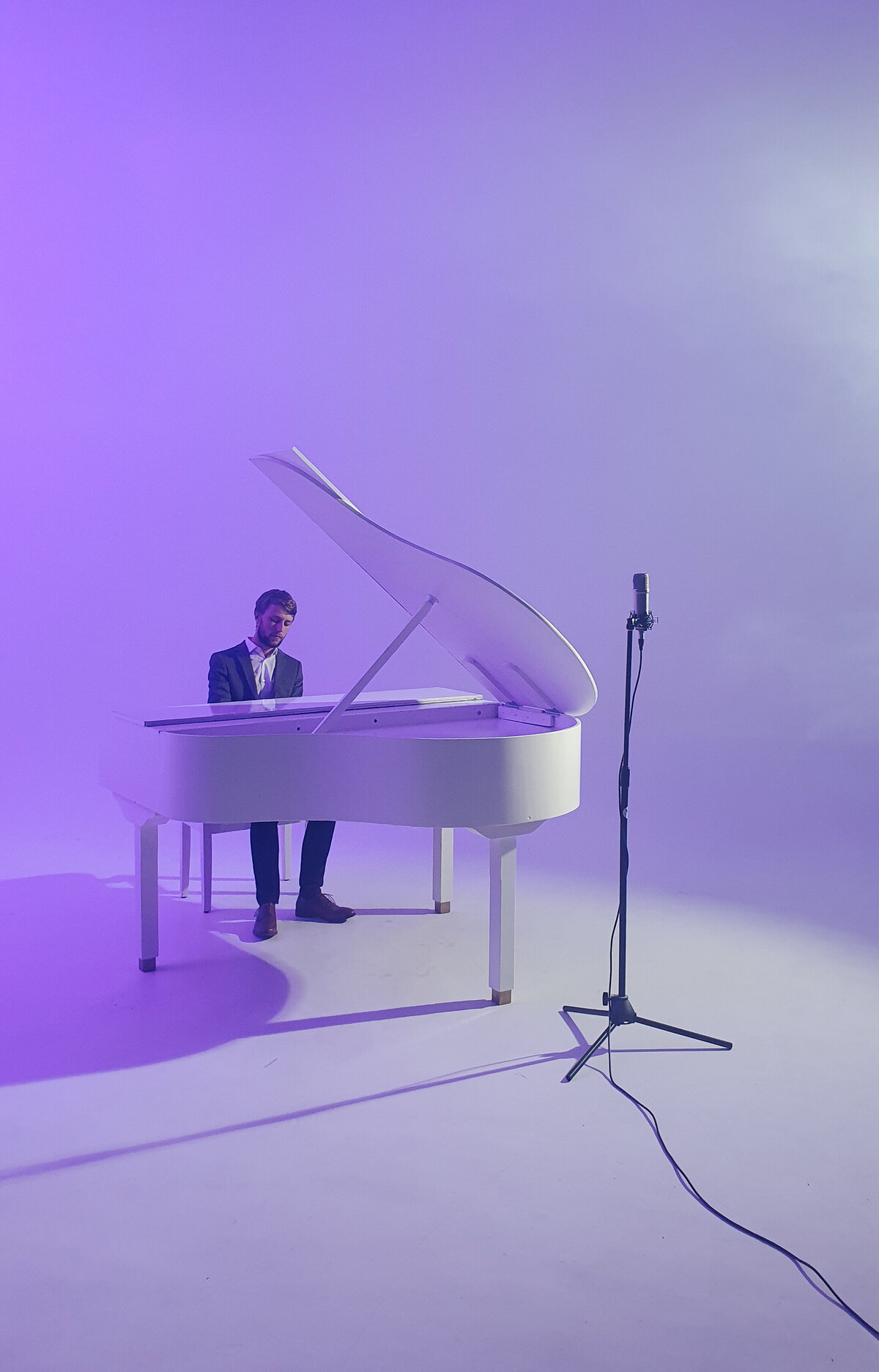 white baby grand piano hire for video shoot