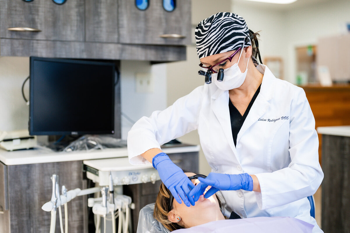 Dr. Louisa Rodriguez, lead dentist at Delicate Dentistry in Palm Harbor, Florida, providing compassionate dental care during a patient visit. Known for her gentle approach and attention to detail, Dr. Rodriguez specializes in cosmetic and general dentistry, creating a stress-free experience for every patient.