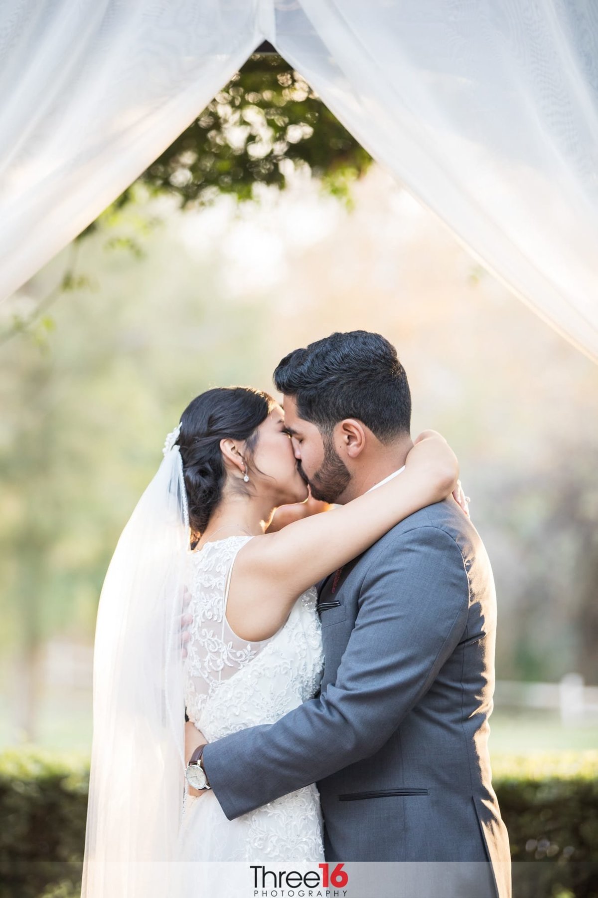 Bride and Groom share their first kiss