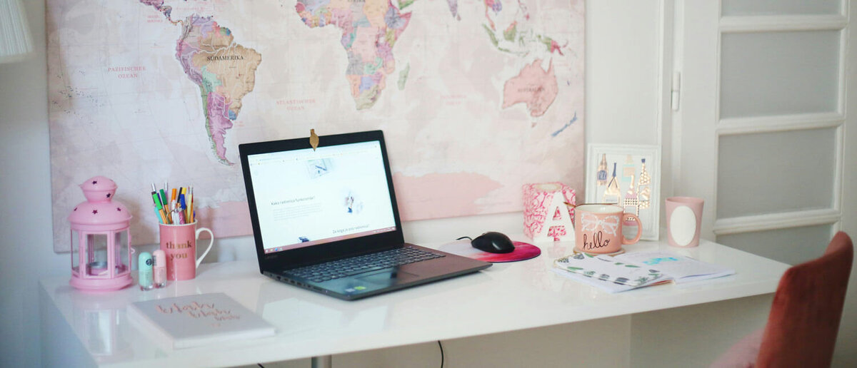 Entrepreneur's desk with a computer and other assorted office supplies