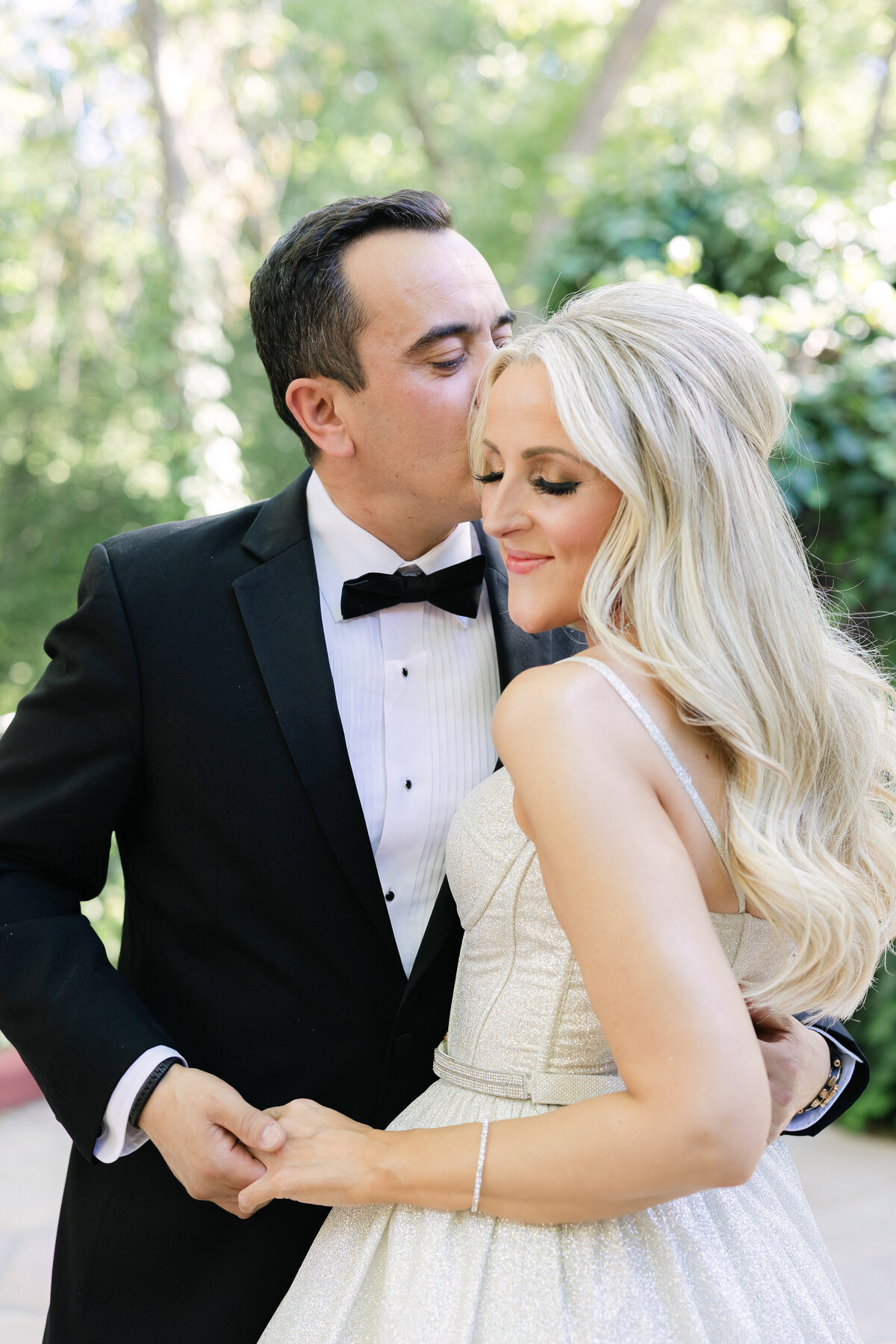 creekside wedding at laberge sedona, groom kissing bride