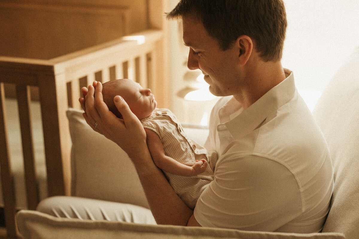 Newborn sleeping in bassinet during Smyrna in-home photography session