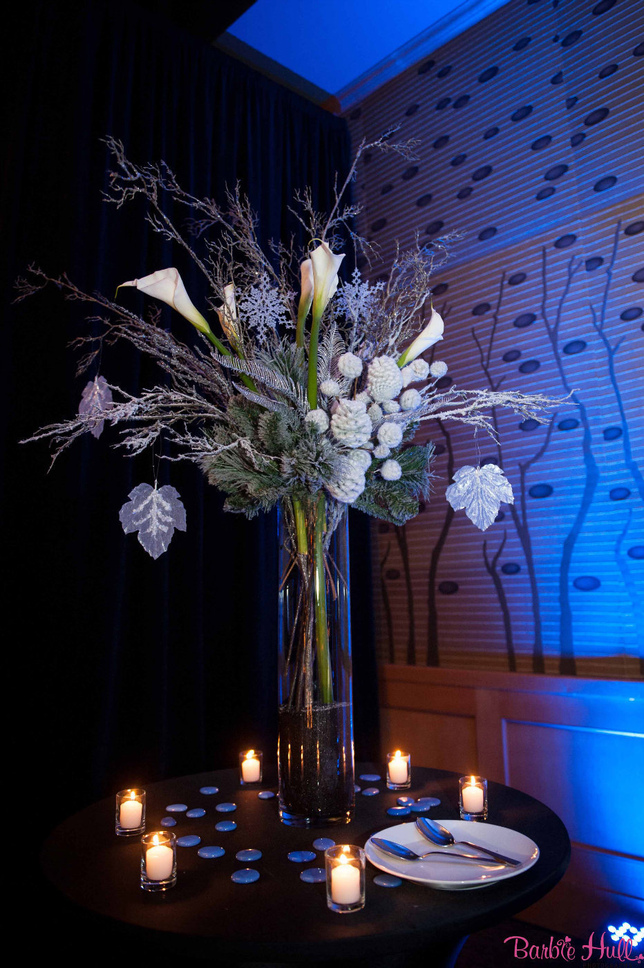 large bar arrangement for corporate holiday party with white calla lilies, sparkle branches, silver leaves