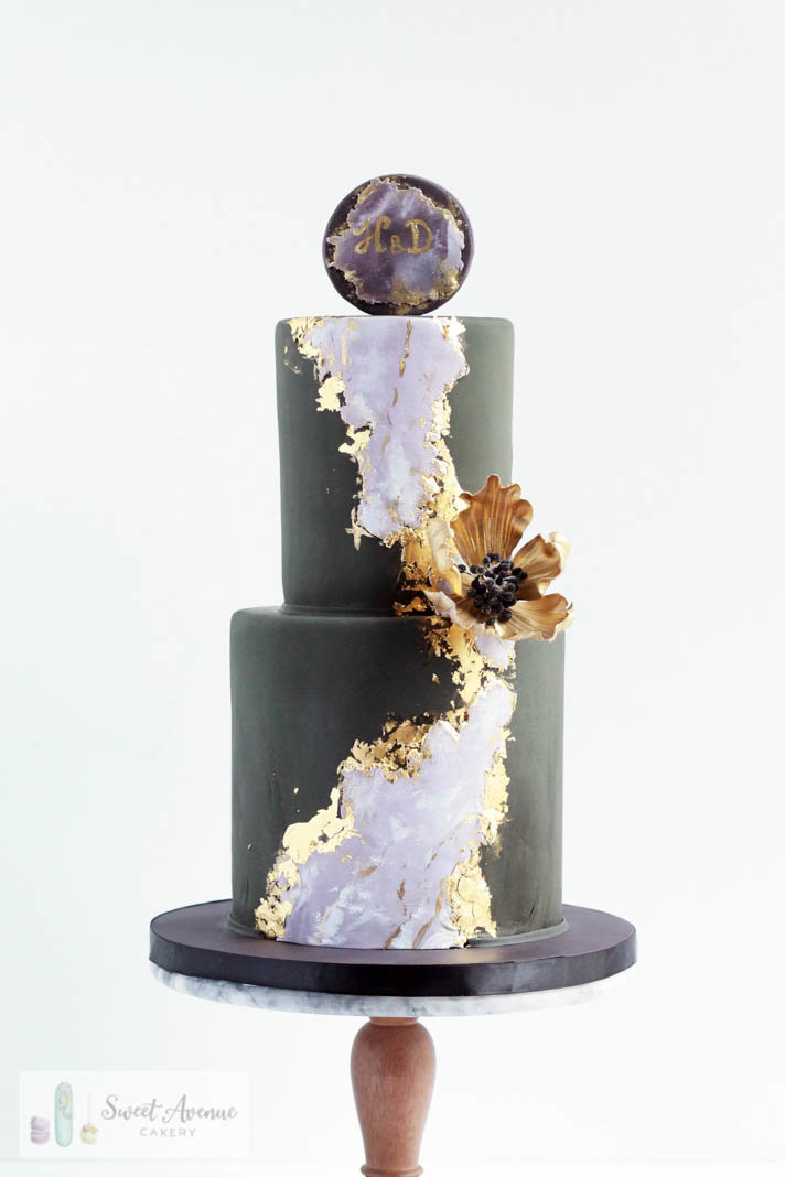 elegant black and marble cake with gold leaf foil