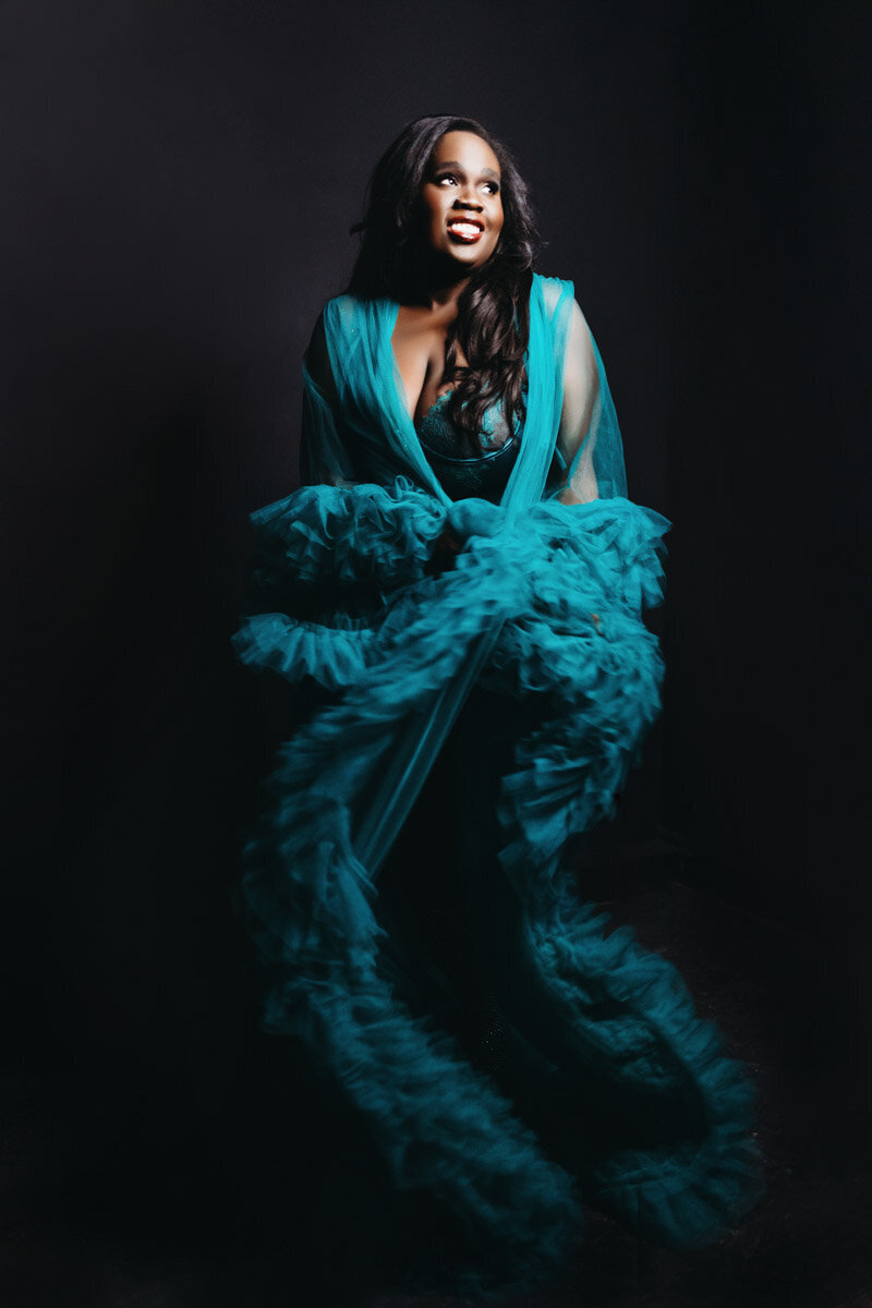 Portrait of black woman wearing a fabulous blue robe