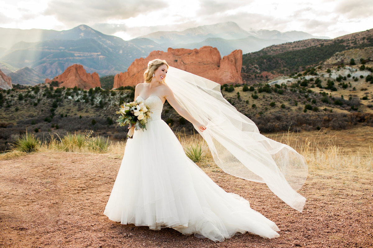 bride with long veil at Colorado Springs wedding  photography
