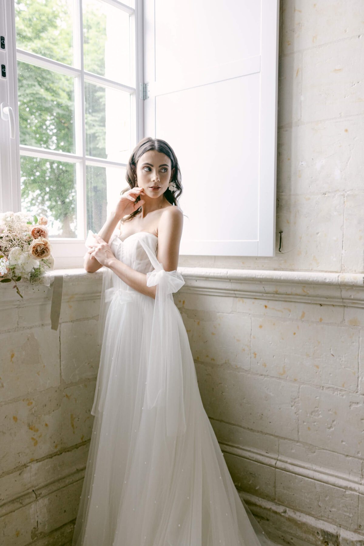 A wedding day photo of a bride in her white wedding dress at Chateau de Jalesnes in France