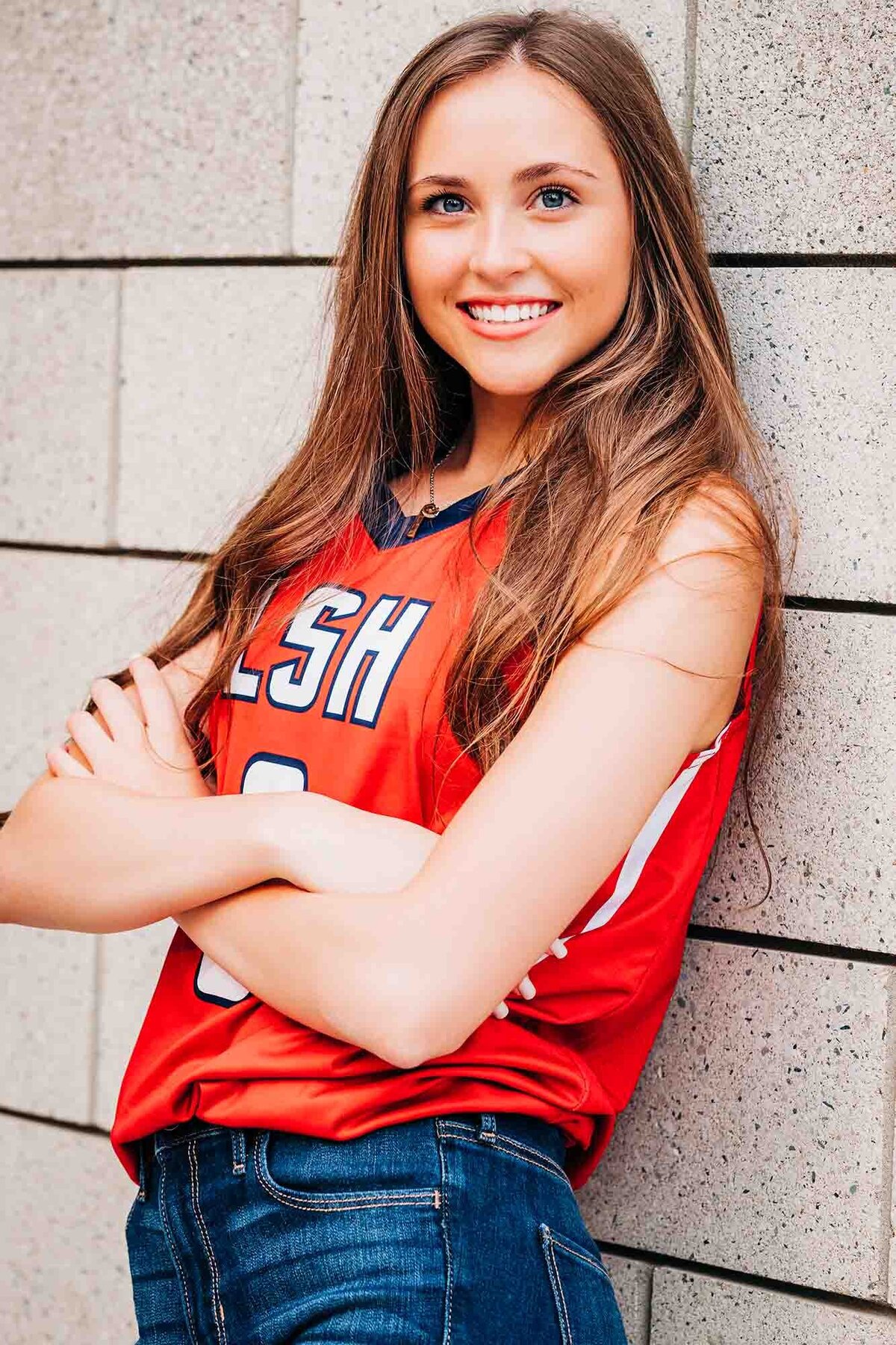 Senior portrait Missoula high school girl in red sports jersey