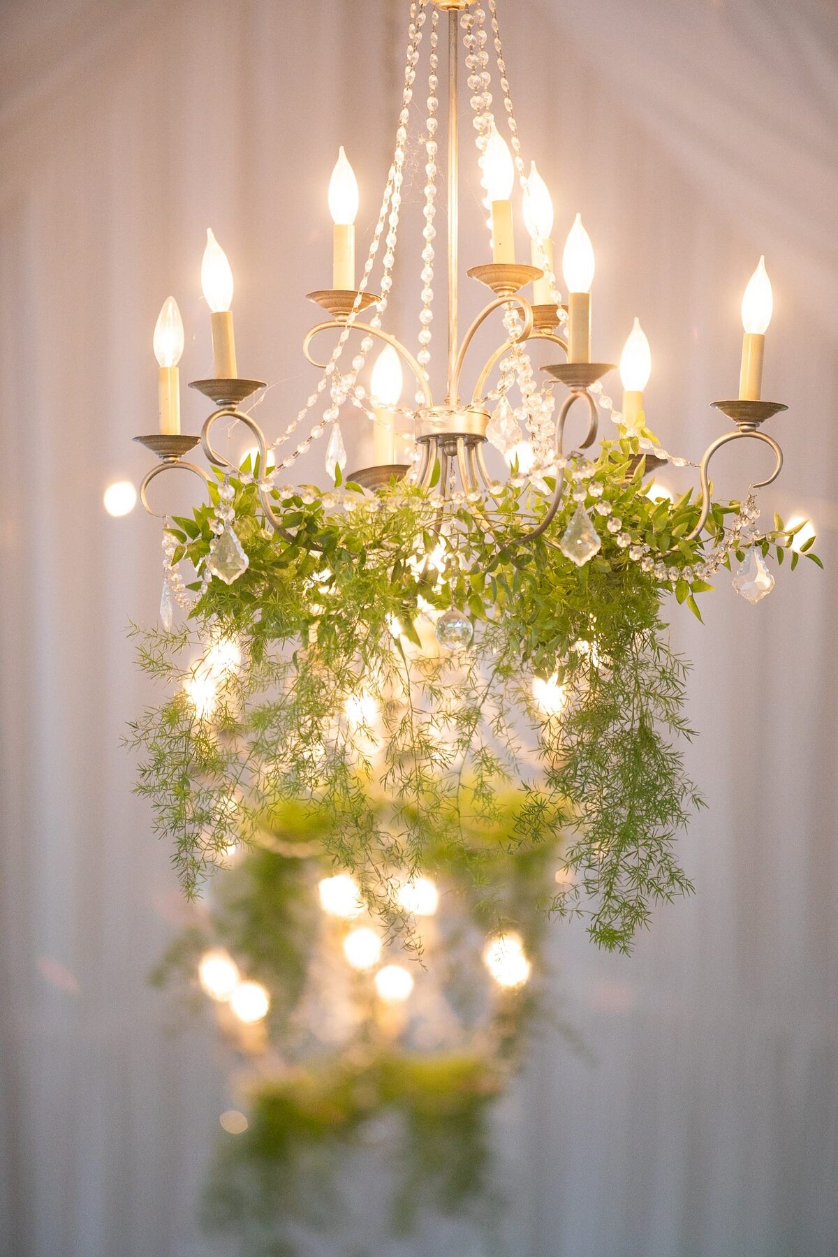 chandeliers-greenery-tent-wedding