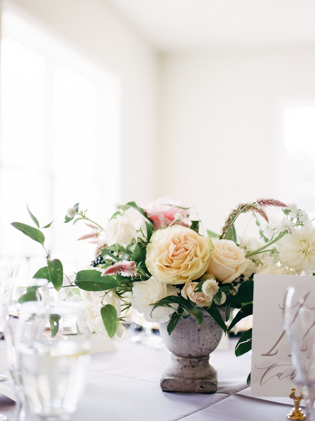 table centerpiece with florals and greenery