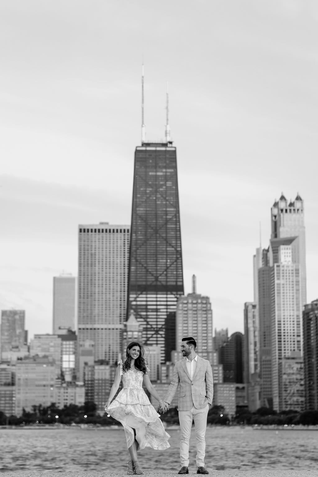 An engagement photography session at The Wrigley Building and North Ave Beach in Chicago, Illinois - 41