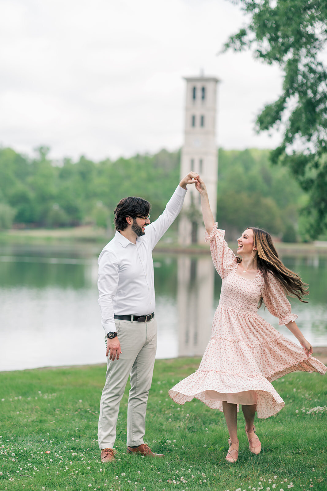 Mom and Dad dancing candid photo during family photo session near Charlotte NC
