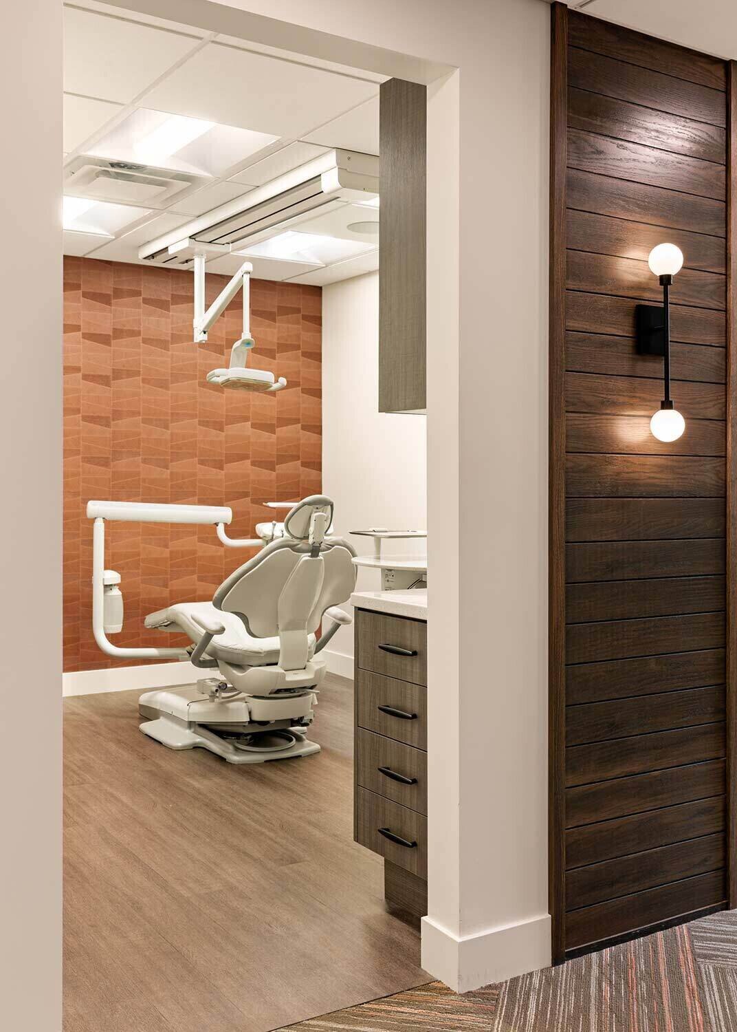 Colorful wallpaper and warm wood wall accent in dental office